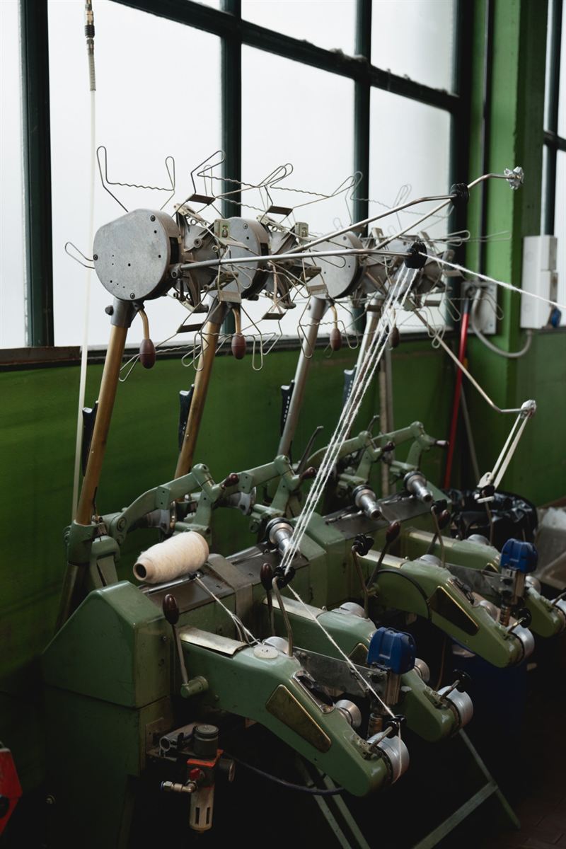 Vintage winding machines winding yarn onto cones